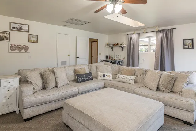 a bed room with a bed and a book shelf