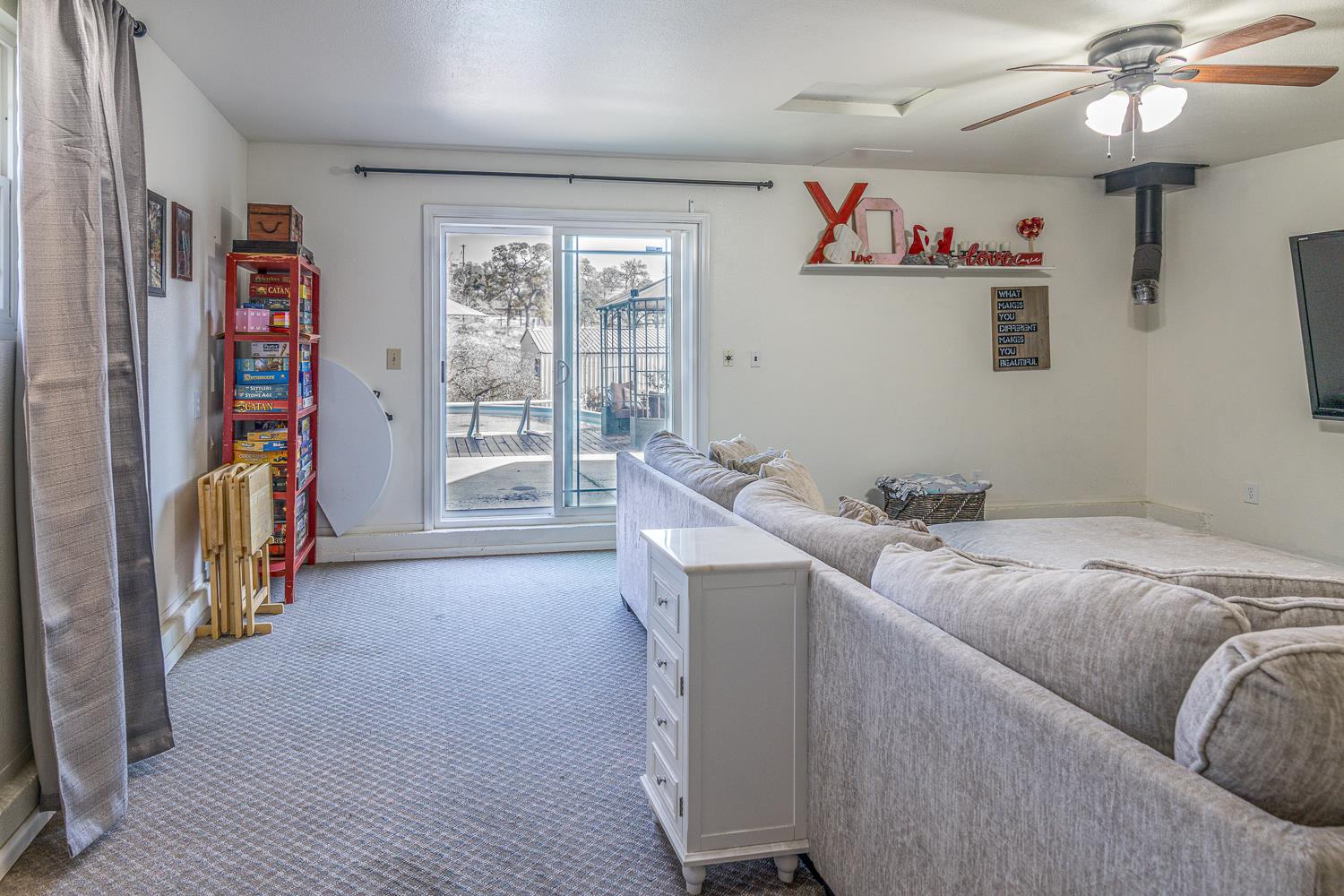 2155 El Faro Way La Grange, CA 95329 - Photo 30 of 52 a bed room with a bed and a book shelf