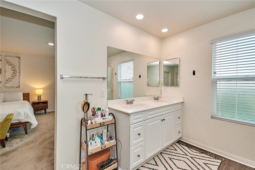 2375 Vineyard Street Upland, CA 91786 - Photo 15 of 33 a spacious bathroom with a sink mirror and vanity