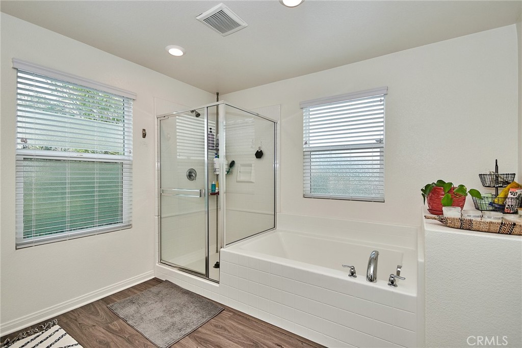 2375 Vineyard Street Upland, CA 91786 - Photo 16 of 33 a bathroom with a tub a sink and a window