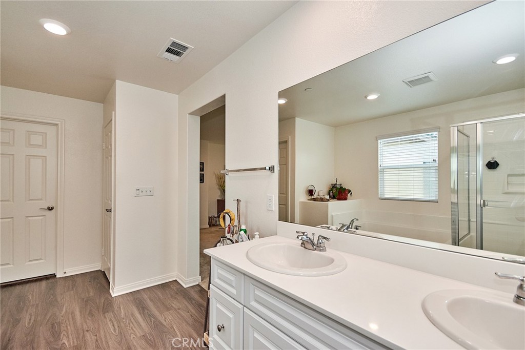 2375 Vineyard Street Upland, CA 91786 - Photo 17 of 33 a bathroom with a sink and a large mirror