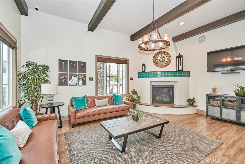 2375 Vineyard Street Upland, CA 91786 - Photo 28 of 33 a living room with furniture a flat screen tv and a fireplace