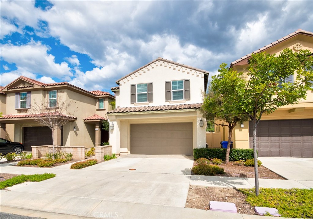 2375 Vineyard Street Upland, CA 91786 - Photo 33 of 33 a front view of a house with a yard and garage