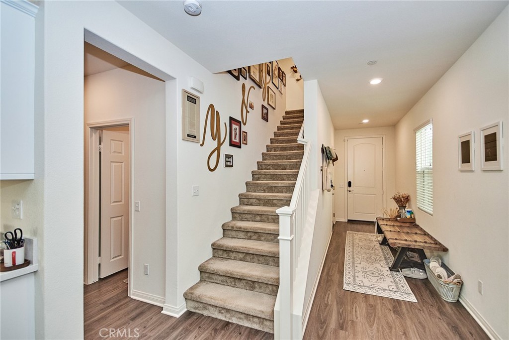 2375 Vineyard Street Upland, CA 91786 - Photo 5 of 33 a view of a hallway with wooden floor and staircase