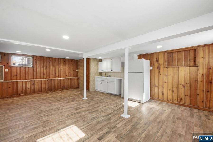 693 North 8th Street Newark, NJ 07107 - Photo 12 of 23 a view of empty room with wooden floor and cabinet