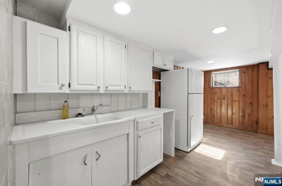 693 North 8th Street Newark, NJ 07107 - Photo 13 of 23 a kitchen with stainless steel appliances granite countertop a refrigerator sink and cabinets