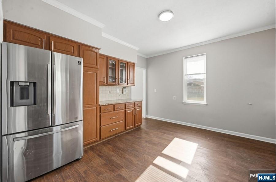 693 North 8th Street Newark, NJ 07107 - Photo 4 of 23 a kitchen with stainless steel appliances a refrigerator and wooden floor