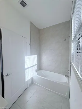 a white bath tub sitting in a bathroom