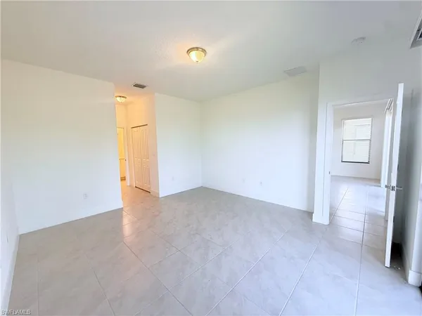 a bathroom with a granite countertop sink a mirror a shower and a bathtub