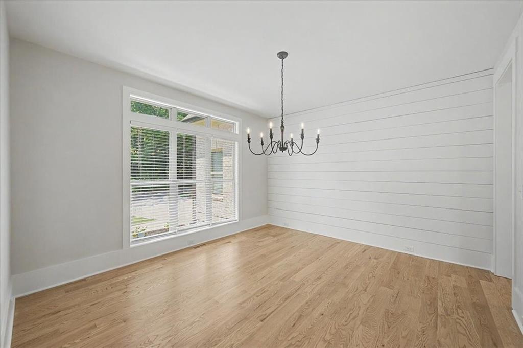 217 Laura Lake Road Marietta, GA 30066 - Photo 8 of 54 a view of empty room with wooden floor and fan