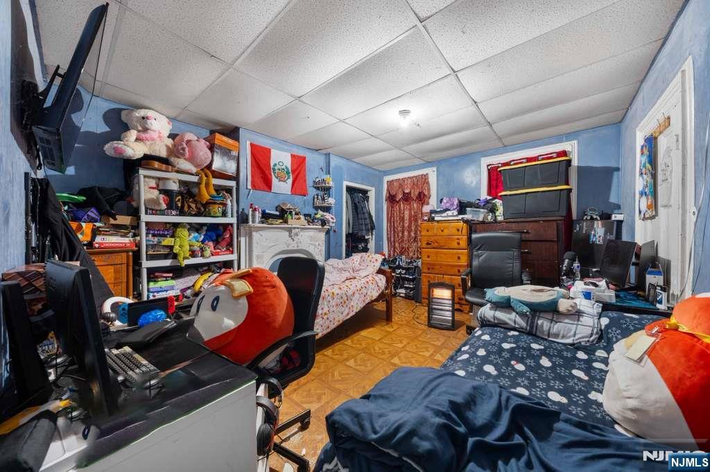 610 Main Street Paterson, NJ 07503 - Photo 12 of 30 a living room with lots of furniture and a flat screen tv