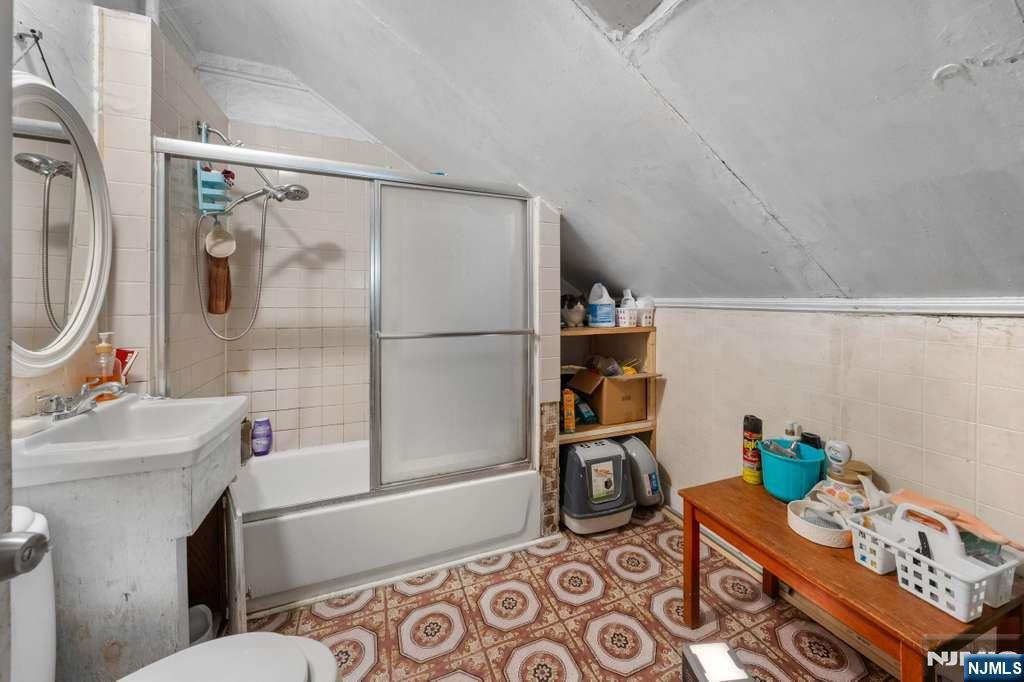 610 Main Street Paterson, NJ 07503 - Photo 13 of 30 a bathroom with a sink toilet and shower