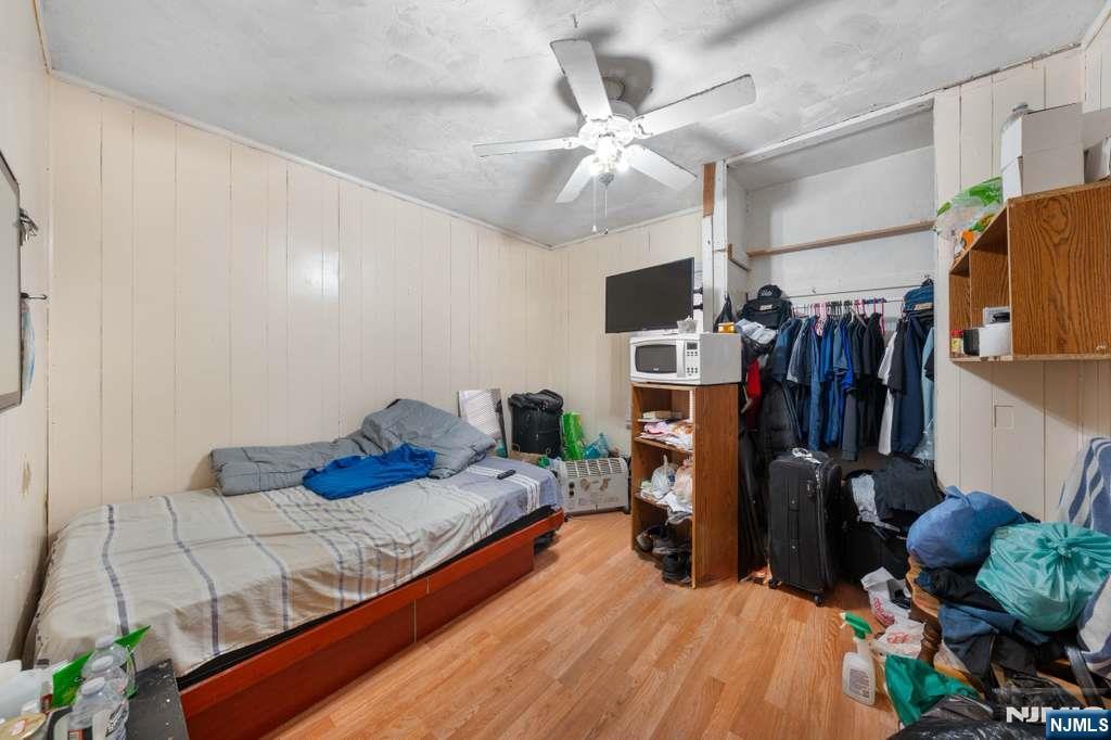 610 Main Street Paterson, NJ 07503 - Photo 14 of 30 a bedroom with bed and a window