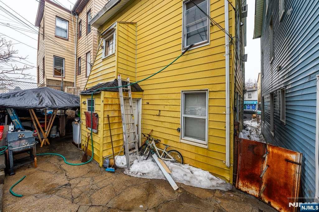 610 Main Street Paterson, NJ 07503 - Photo 18 of 30 a view of a house with a patio