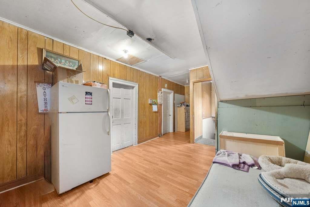 610 Main Street Paterson, NJ 07503 - Photo 30 of 30 a bedroom with a bed and a refrigerator