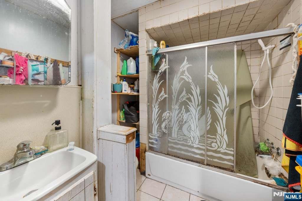 610 Main Street Paterson, NJ 07503 - Photo 8 of 30 a bathroom with a sink toilet and shower
