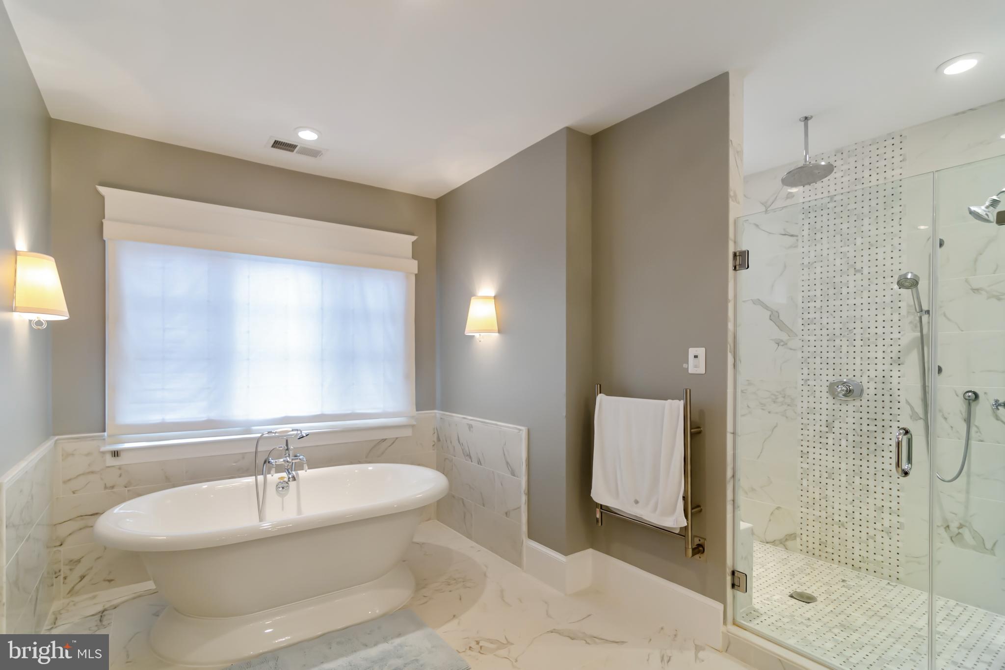 6801 Danforth Street McLean, VA 22101 - Photo 19 of 29 a bathroom with a bathtub shower sink mirror and toilet