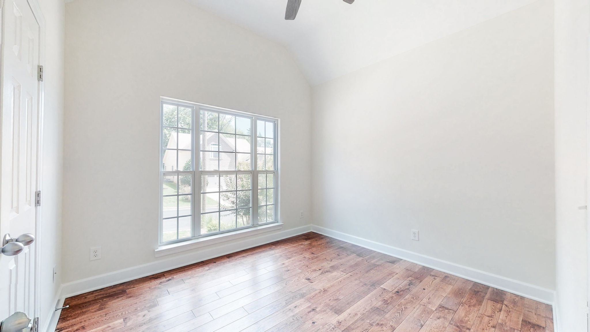 2030 Spring Branch Drive Madison, TN 37115 - Photo 14 of 32 an empty room with wooden floor and windows