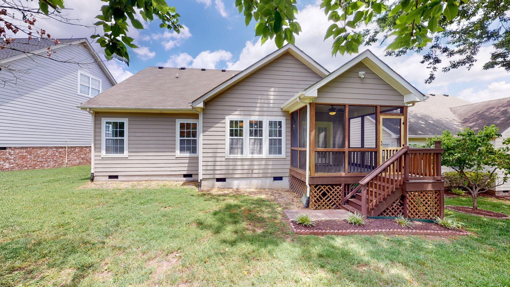 2030 Spring Branch Drive Madison, TN 37115 - Photo 17 of 32 a view of a house with a yard and lawn chairs
