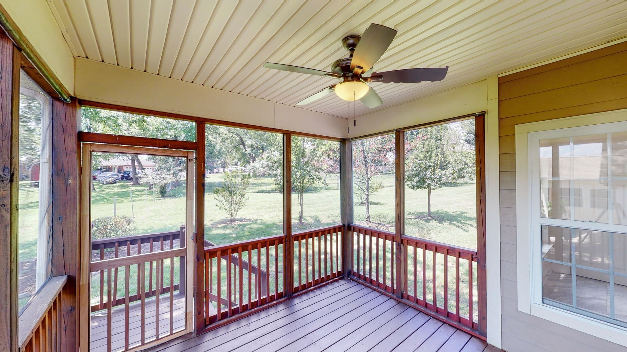 2030 Spring Branch Drive Madison, TN 37115 - Photo 19 of 32 a view of a big room with wooden floor a ceiling fan and windows