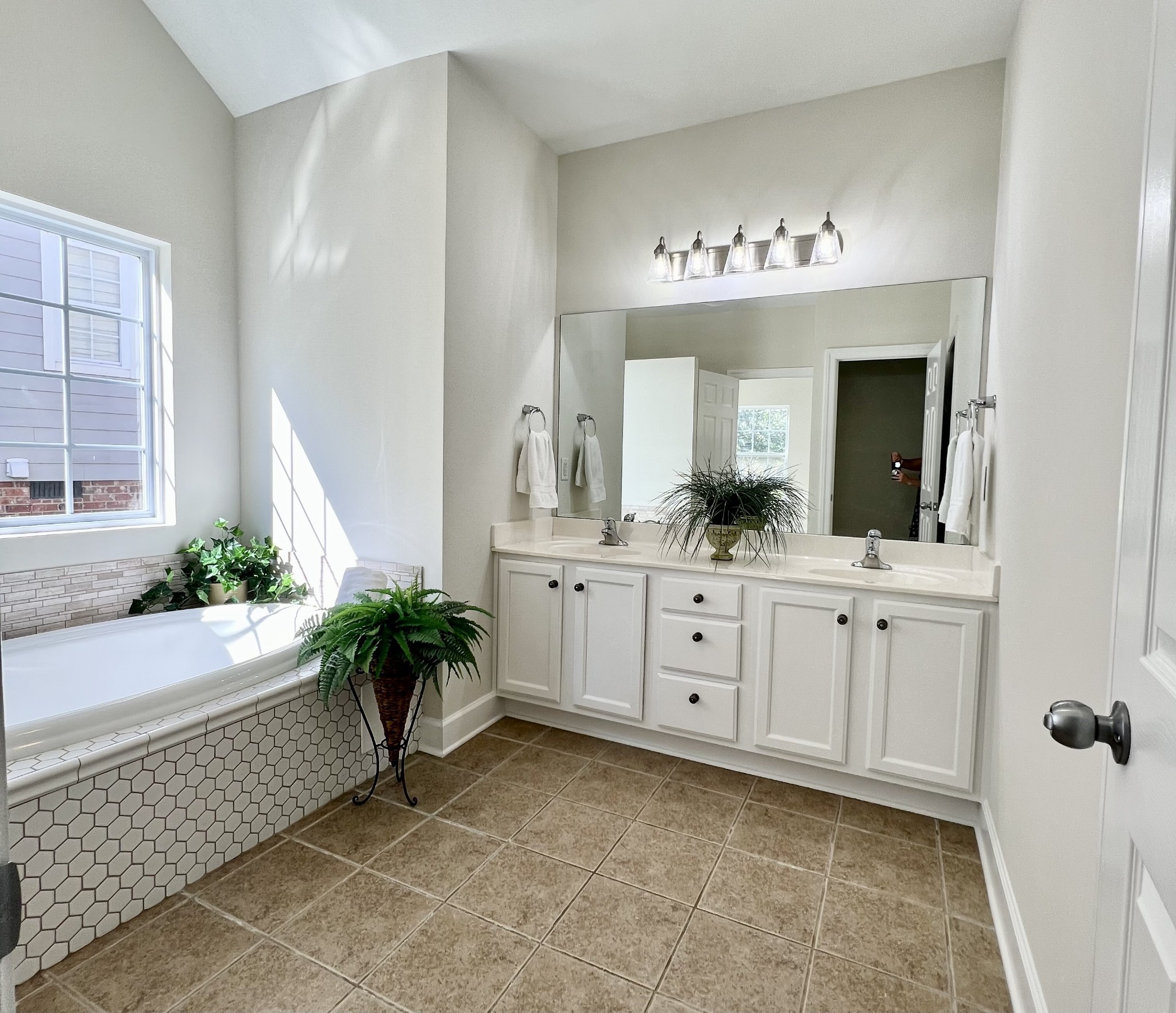 2030 Spring Branch Drive Madison, TN 37115 - Photo 26 of 32 a spacious bathroom with a double vanity sink and a mirror