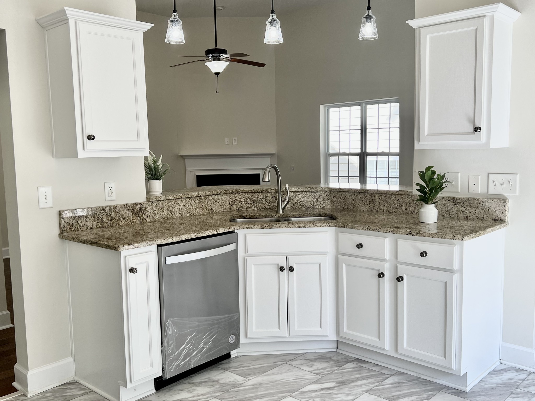 2030 Spring Branch Drive Madison, TN 37115 - Photo 28 of 32 a kitchen with granite countertop a sink stainless steel appliances and cabinets