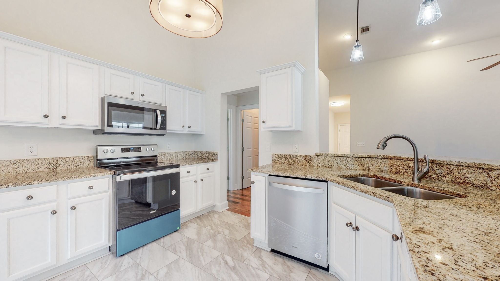 2030 Spring Branch Drive Madison, TN 37115 - Photo 5 of 32 a kitchen with white cabinets stainless steel appliances and sink