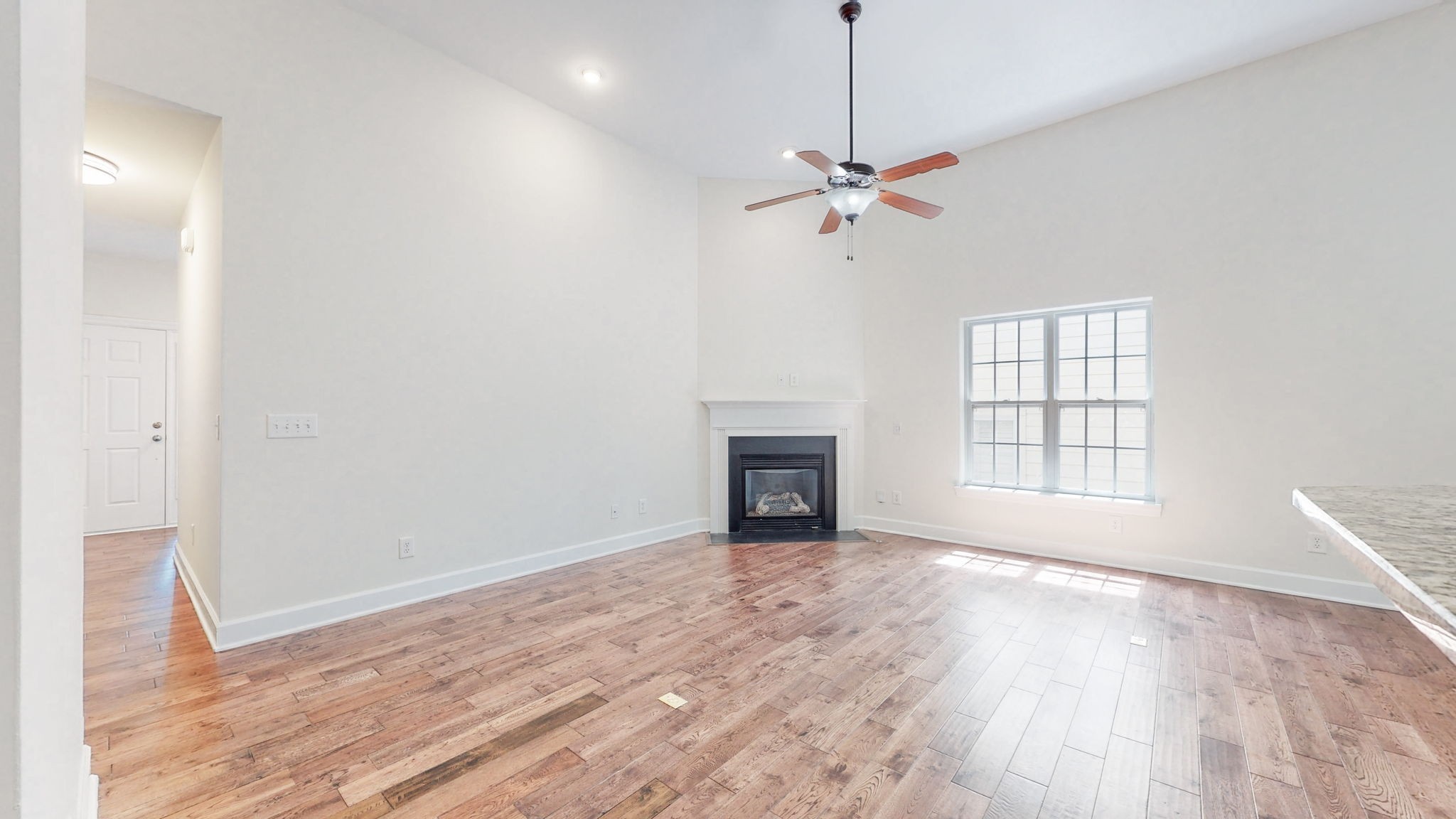 2030 Spring Branch Drive Madison, TN 37115 - Photo 9 of 32 a view of empty room with wooden floor and fan