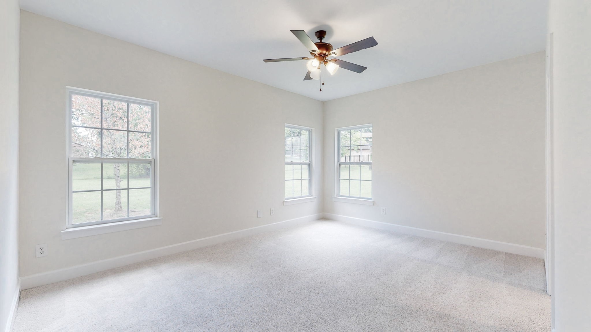 2030 Spring Branch Drive Madison, TN 37115 - Photo 10 of 32 an empty room with windows and chandelier fan