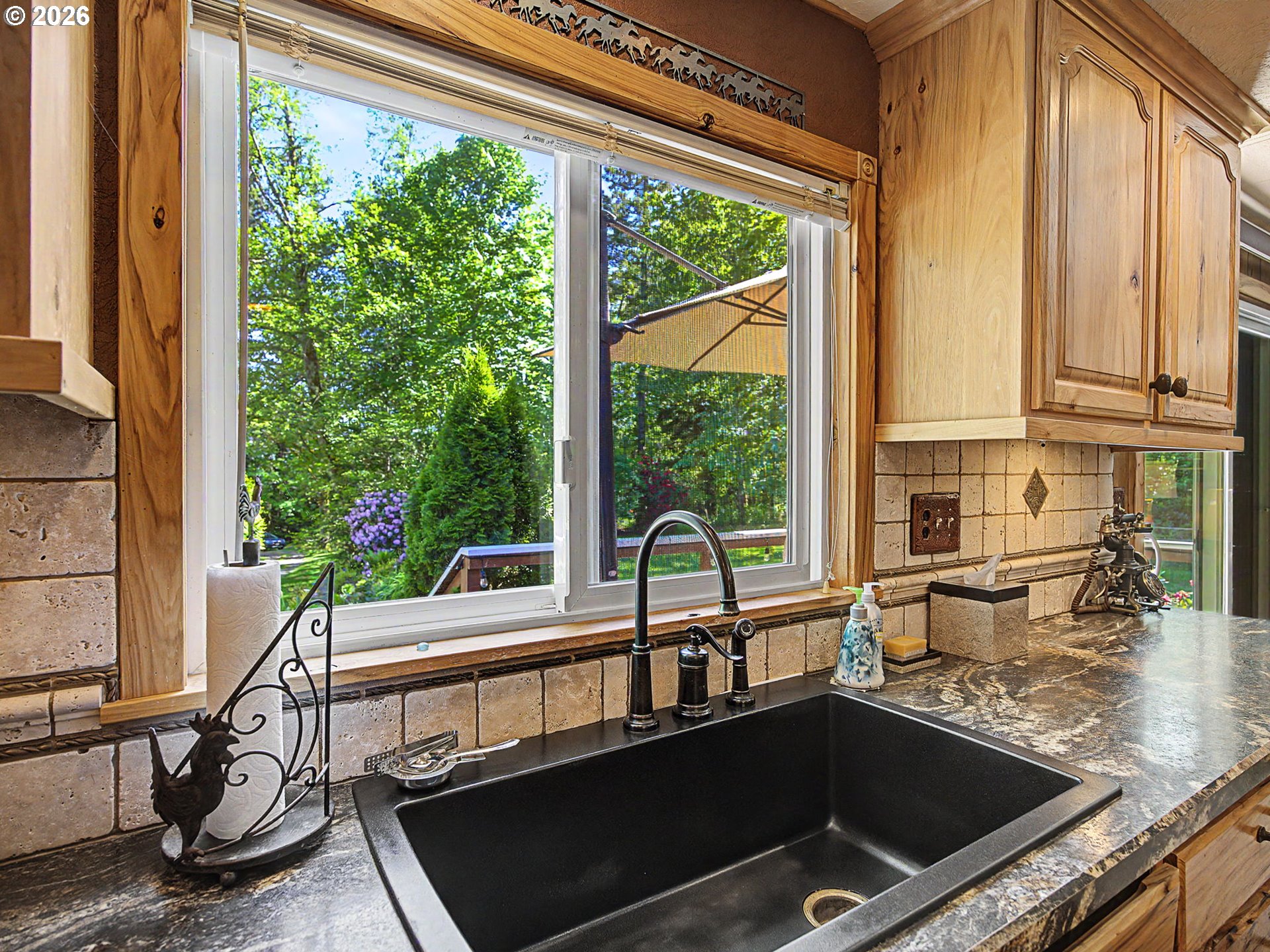 50995 Southeast Baty Road Sandy, OR 97055 - Photo 12 of 47 a view of a living room and kitchen with a large window