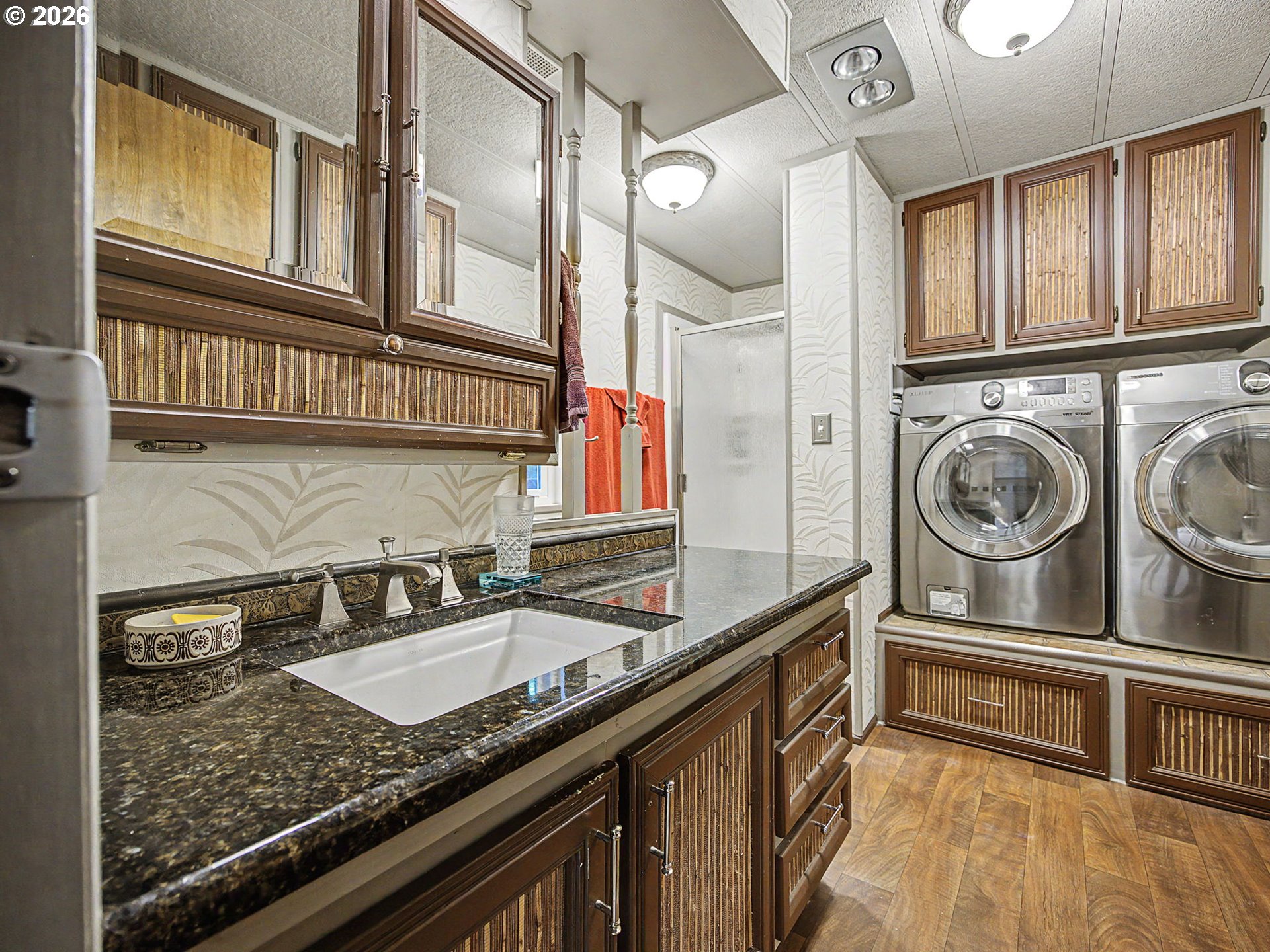 50995 Southeast Baty Road Sandy, OR 97055 - Photo 20 of 47 a kitchen with stainless steel appliances granite countertop a sink and cabinets