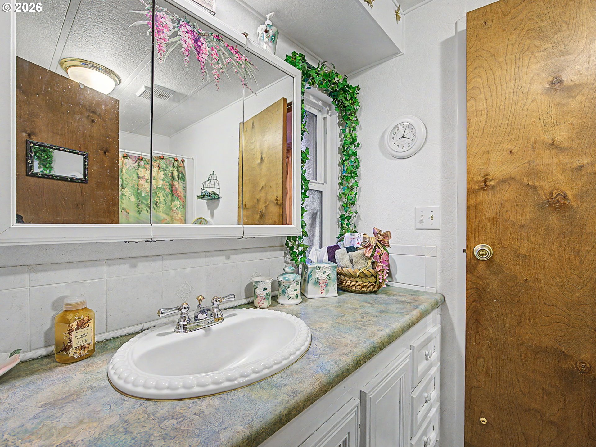 50995 Southeast Baty Road Sandy, OR 97055 - Photo 25 of 47 a bathroom with a granite countertop sink and a mirror