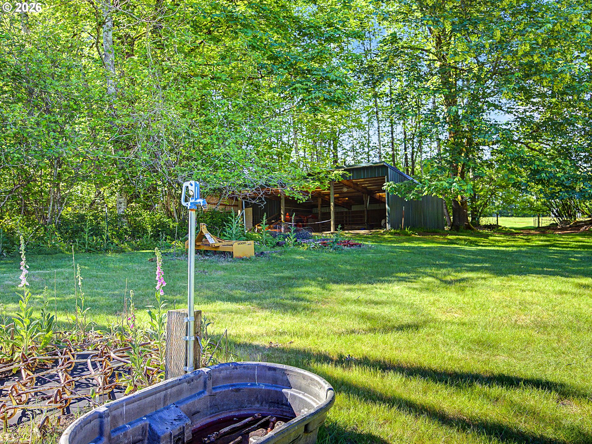 50995 Southeast Baty Road Sandy, OR 97055 - Photo 34 of 47 a view of a backyard with a garden and entertaining space