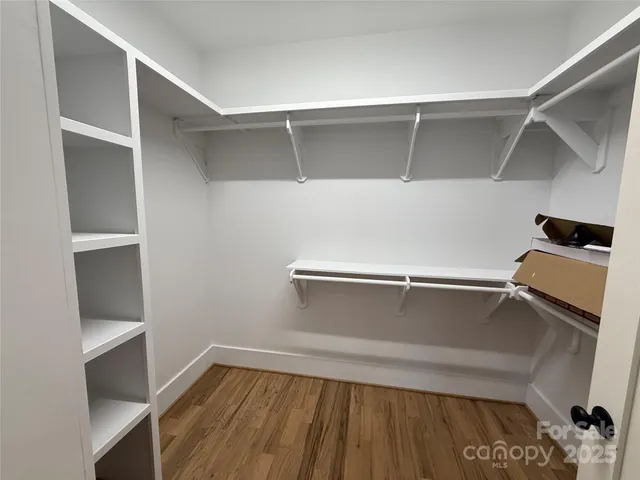 a view of an empty walk in closet