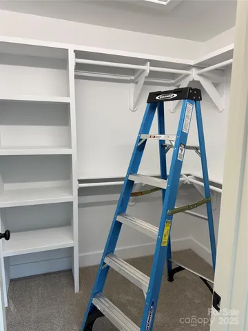 a view of an empty walk in closet