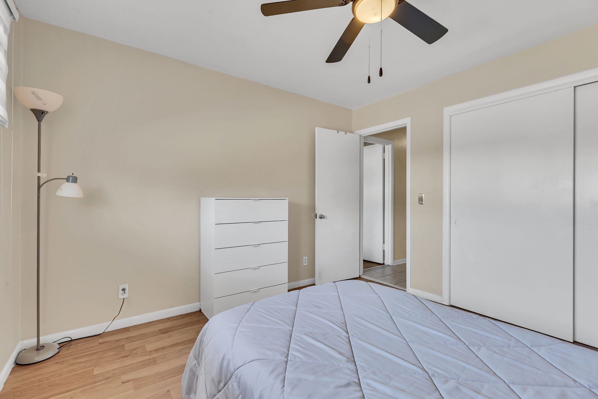 613 Hillsboro Road, Unit D23 Franklin, TN 37064 - Photo 14 of 18 a bedroom with a bed and a chandelier fan