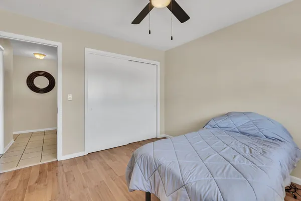 a bedroom with bed and window