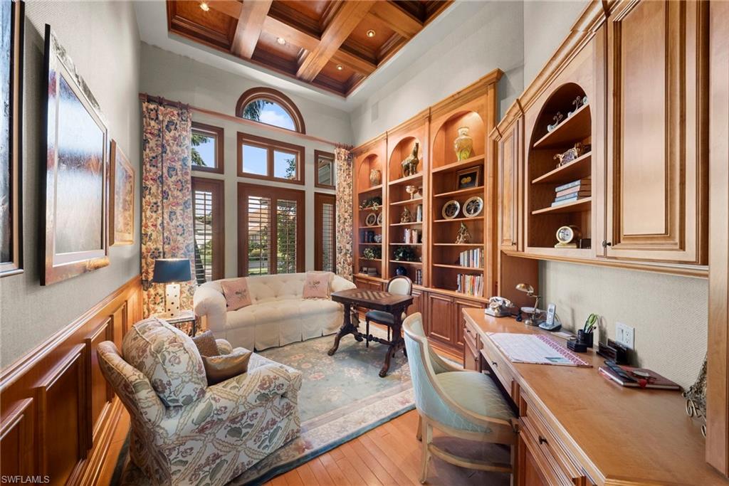 10057 Orchid Ridge Lane Estero, FL 34135 - Photo 13 of 30 a living room with fireplace furniture and a large window