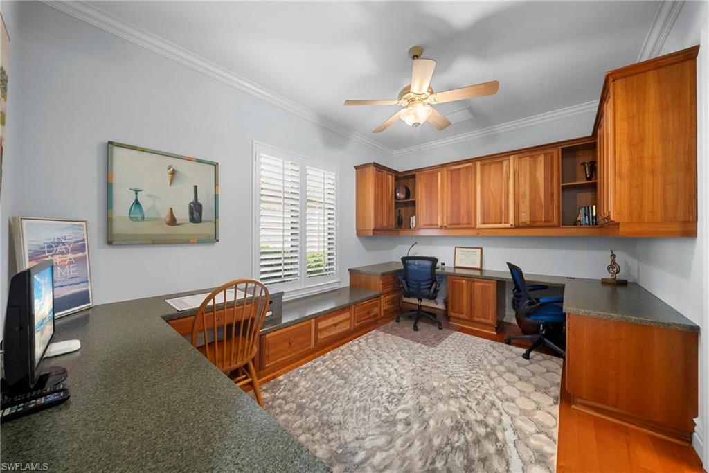 10057 Orchid Ridge Lane Estero, FL 34135 - Photo 19 of 30 a living room with furniture and a flat screen tv