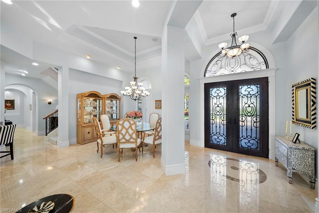 10057 Orchid Ridge Lane Estero, FL 34135 - Photo 2 of 30 an entryway with a chandelier and livingroom view