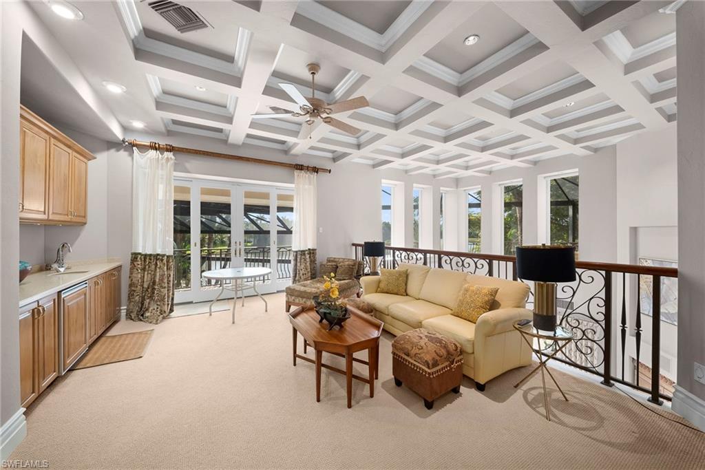 10057 Orchid Ridge Lane Estero, FL 34135 - Photo 21 of 30 a living room with furniture and a large window