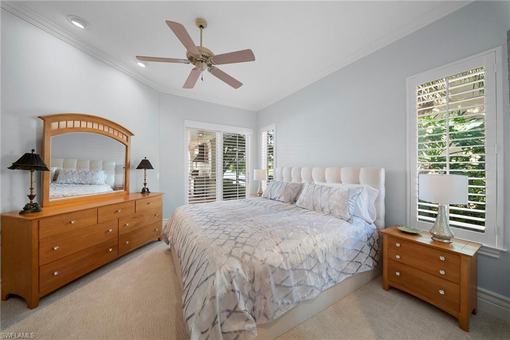 10057 Orchid Ridge Lane Estero, FL 34135 - Photo 25 of 30 a bedroom with a bed and a dresser