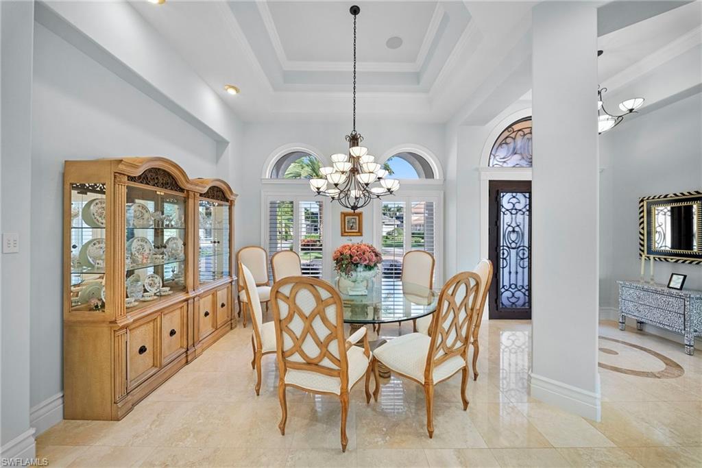 10057 Orchid Ridge Lane Estero, FL 34135 - Photo 3 of 30 a view of a dining room with furniture window and wooden floor