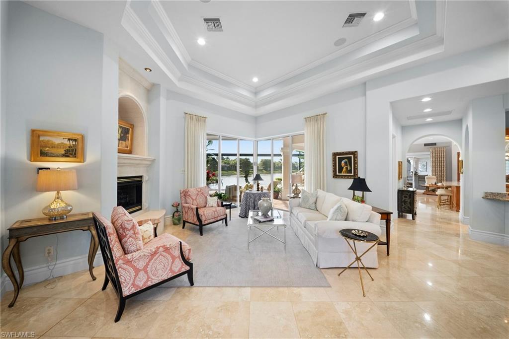 10057 Orchid Ridge Lane Estero, FL 34135 - Photo 4 of 30 a living room with fireplace furniture and a large window