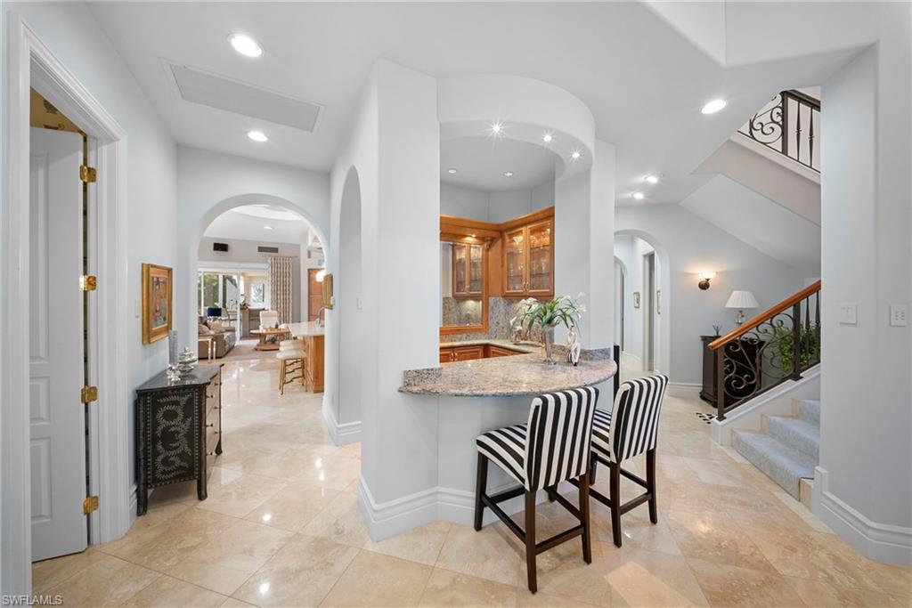 10057 Orchid Ridge Lane Estero, FL 34135 - Photo 5 of 30 an open kitchen with a table and chairs