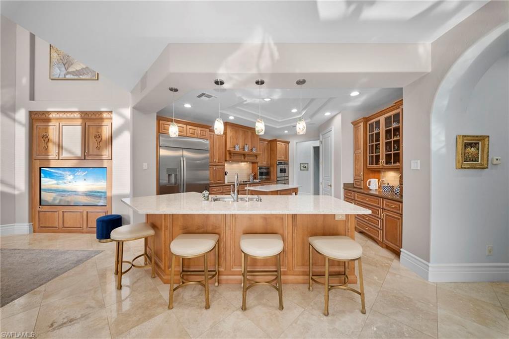 10057 Orchid Ridge Lane Estero, FL 34135 - Photo 8 of 30 a large kitchen with a table and chairs
