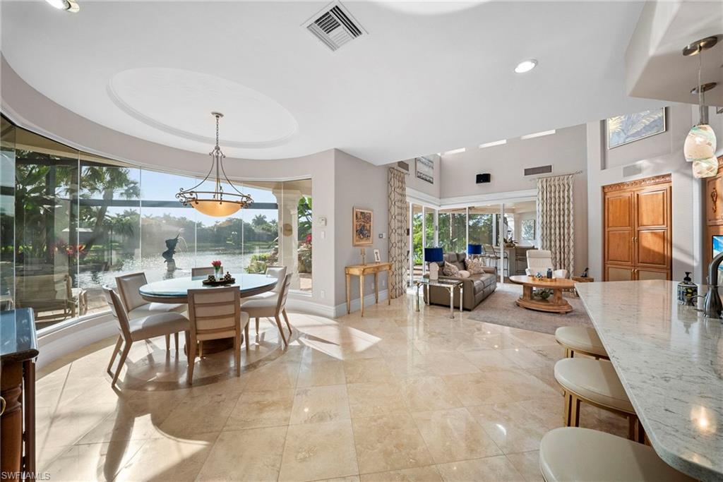 10057 Orchid Ridge Lane Estero, FL 34135 - Photo 10 of 30 a outdoor space with lots of tables a large window and chairs