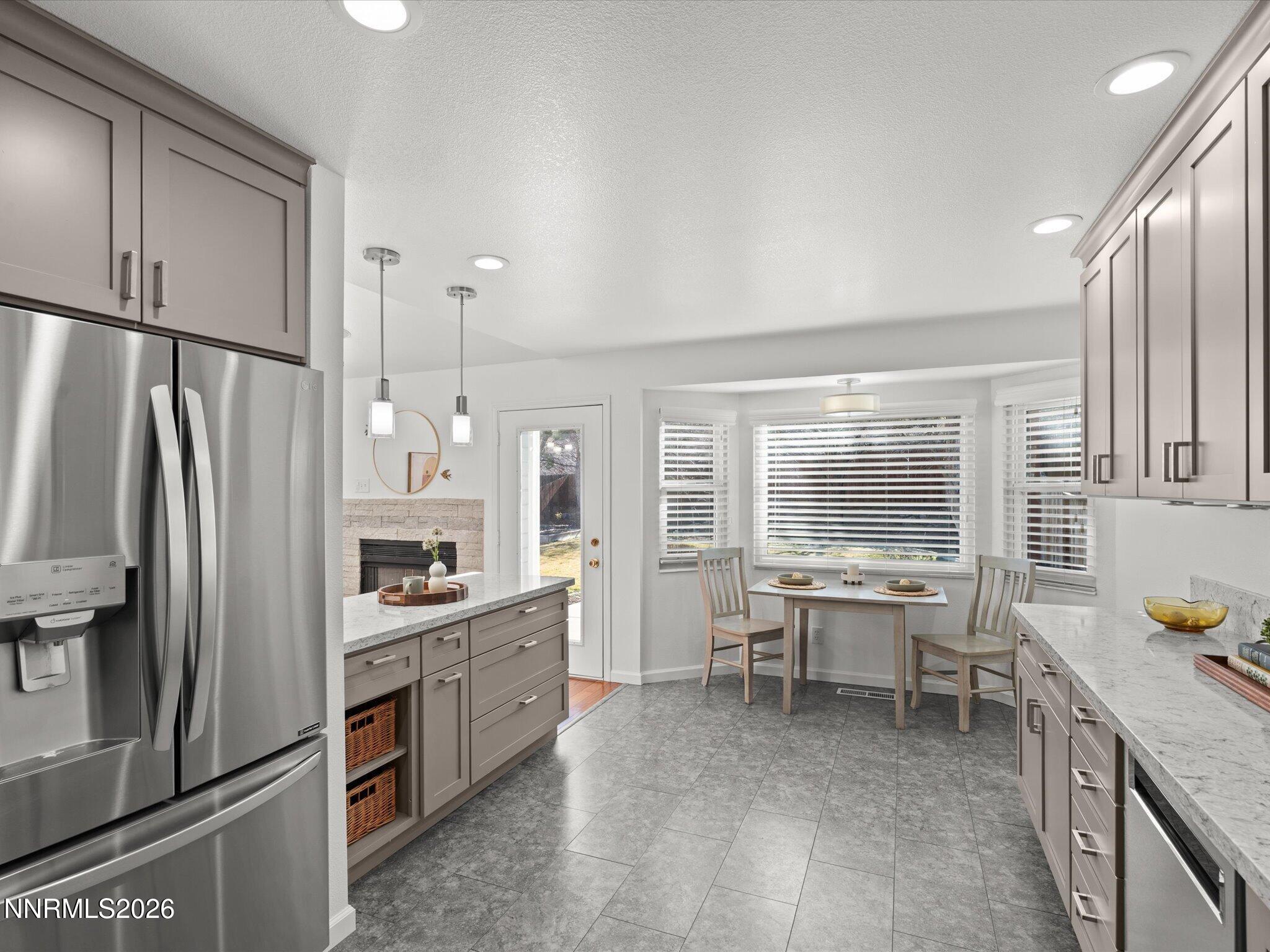 1588 Wheatgrass Drive Reno, NV 89509 - Photo 20 of 42 a kitchen with stainless steel appliances granite countertop a sink stove and refrigerator