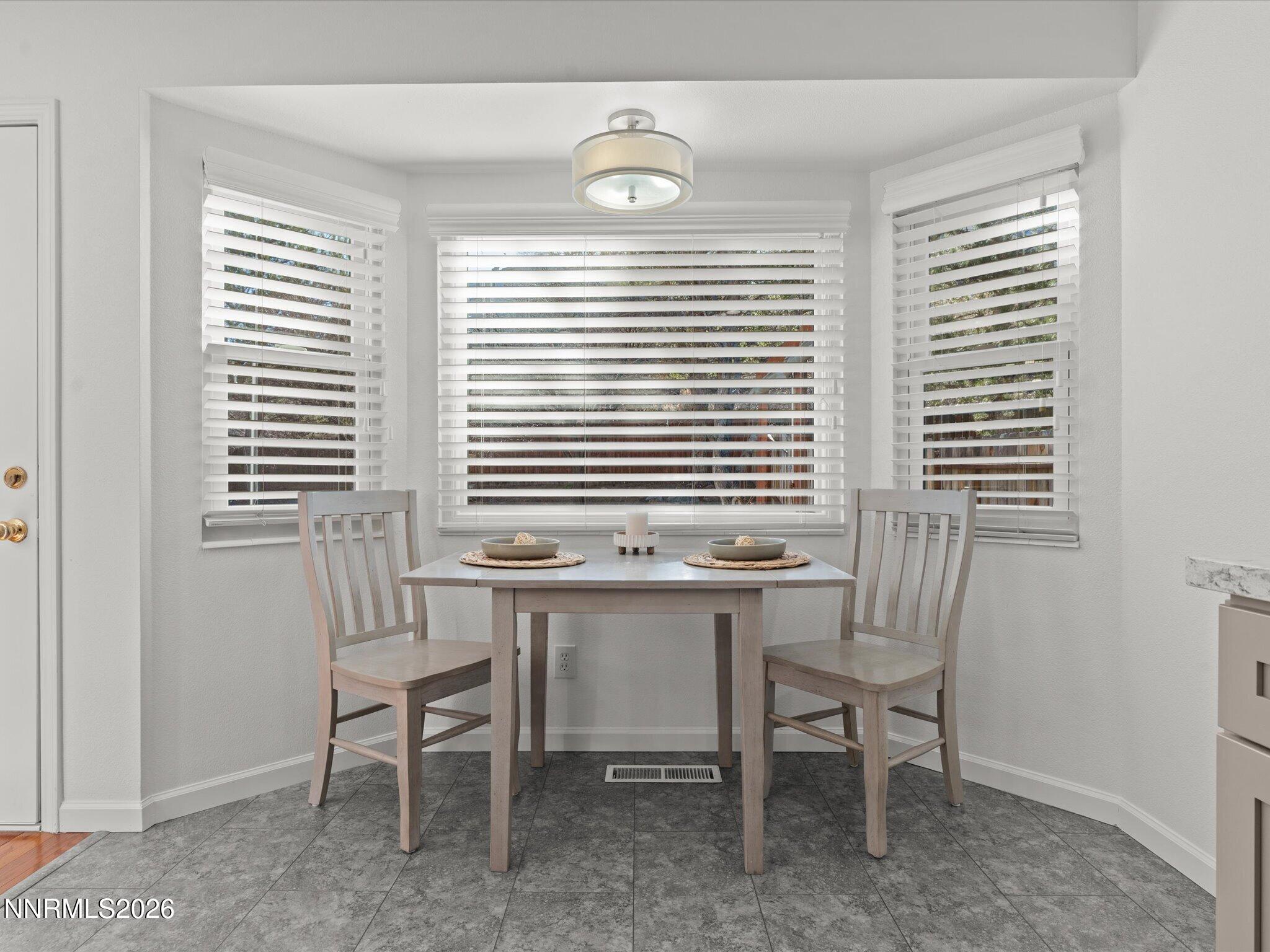 1588 Wheatgrass Drive Reno, NV 89509 - Photo 21 of 42 a dining room with furniture and windows