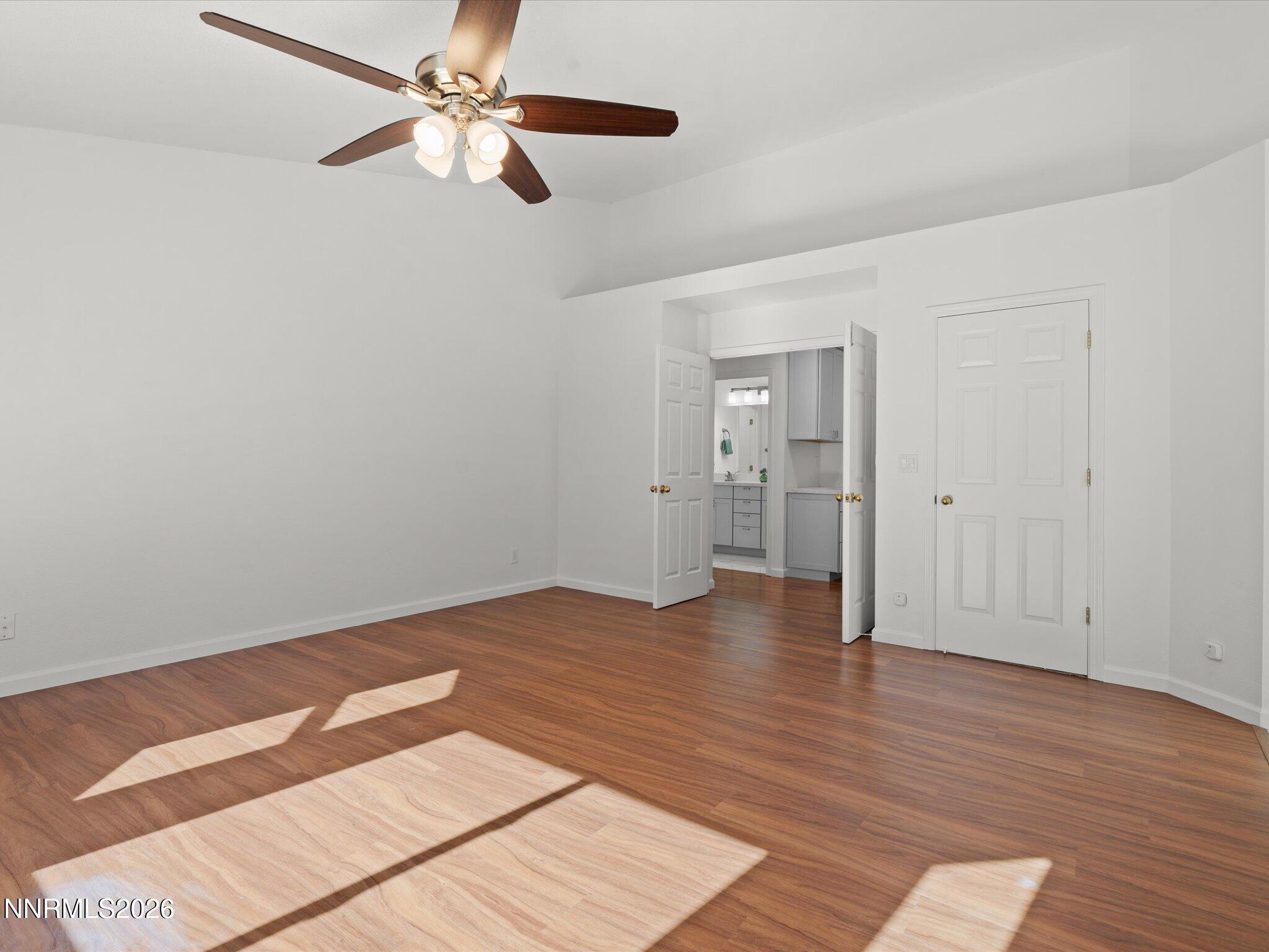 1588 Wheatgrass Drive Reno, NV 89509 - Photo 24 of 42 wooden floor in an empty room with a window